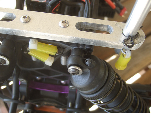 Savage 5T - The only modification I did is used a larger screw for the upper shock mounts. I used the stock platic shock post from the LST and I drilled out the hole to fit a 4mm screw. The stock screw is so small and is prone to bending. That is why I used a larger screw. 