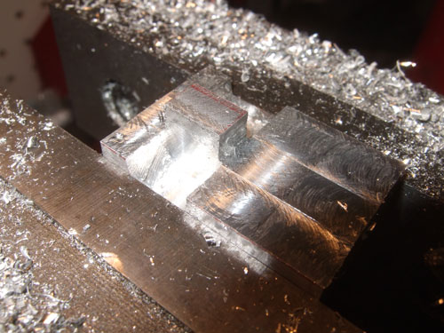 Savage 5T - This is how it looks after I thined out the block a litte bit so there is a little tab that sticks out so I can screw it to the a-arm where the shocks use to be mounted.