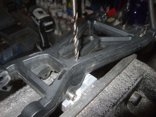 Savage 5T - Here I am drilling a hole through the arm and aluminum shock mount 