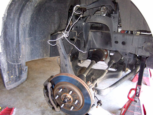 Nissan Titan 2" Leveling Kit: Strut removed for the truck